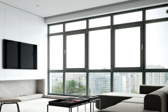aluminium casement windows with charcoal frames and city skyline views