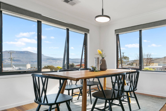 C60 aluminium awning windows in dining room with mountain view